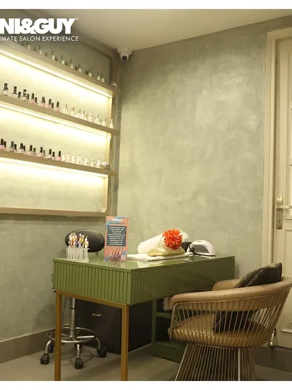 My nail station at the Greater Kailash 1 salon is a dedicated space for creativity and precision. The area is clean, organized, and features back-lit shelves showcasing a wide array of color options.