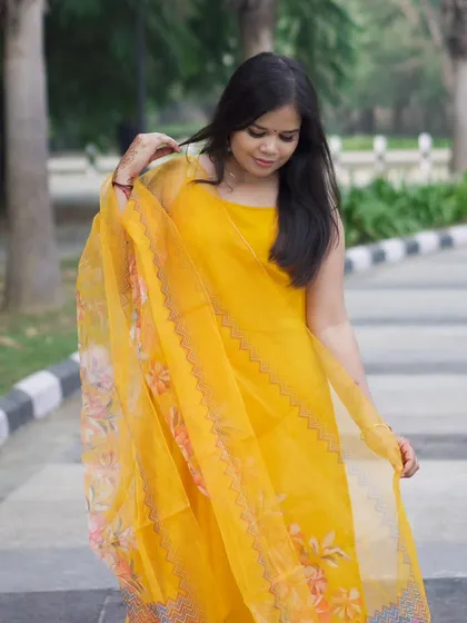 A candid, looking-down pose that adds a thoughtful and gentle mood to the photo series.