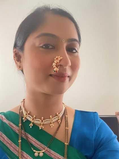 A close-up of Bhavna, showing her beautiful smile and the details of her traditional styling with our Ilkal saree.