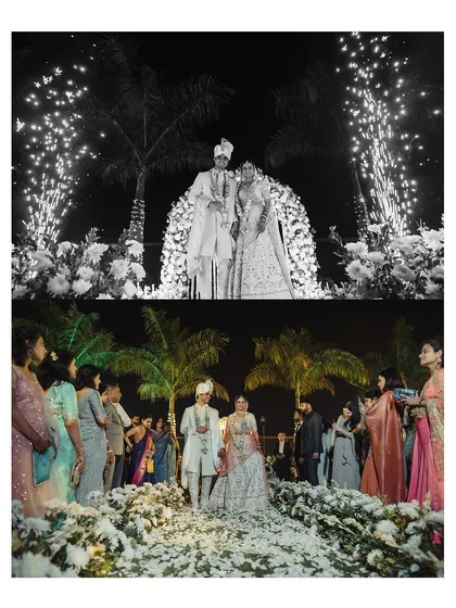 A dramatic black and white shot of the couple's reception, with a grand entry and fireworks creating a truly cinematic feel.