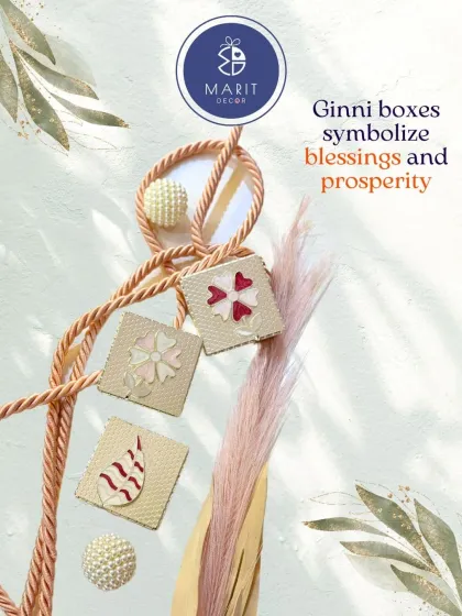 Ginni boxes symbolize blessings and prosperity. This image showcases the intricate designs on the lids, perfect for making your shagun gift memorable.