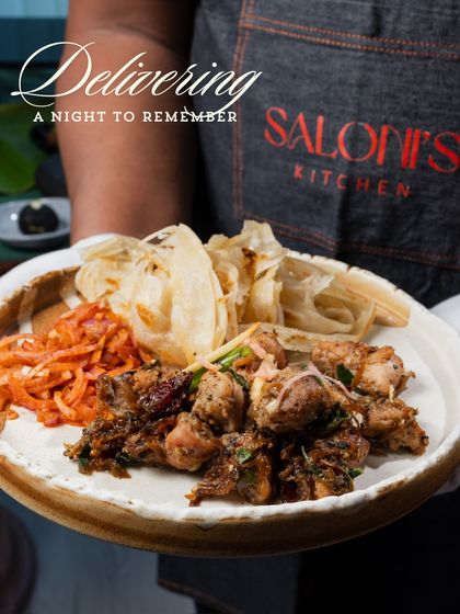 Delivering a night to remember with this plate of Chicken Kali Mirch and flaky Malabar Parotta. This is a perfect example of a hearty and flavorful Indian appetizer.