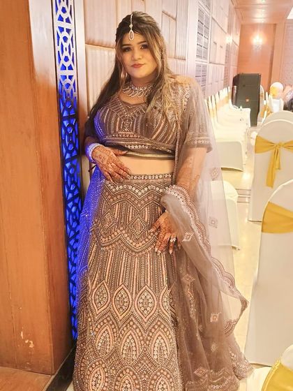 This client is glowing, and her rented lehenga with intricate detailing is the perfect complement.