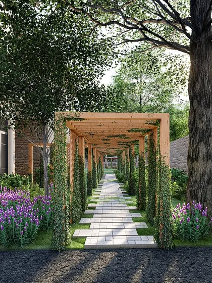 A rectangular wooden pergola, wrapped in cascading flowers and lush foliage, creates a structured yet fairytale-like garden entrance. It is a doorway that is perfectly balanced and naturally enchanting.
