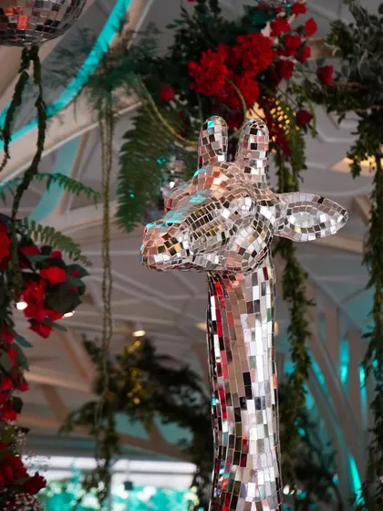 A life-sized giraffe covered in mirror mosaic was a show-stopping, Instagrammable feature at our 'Jungle Disco' reception.