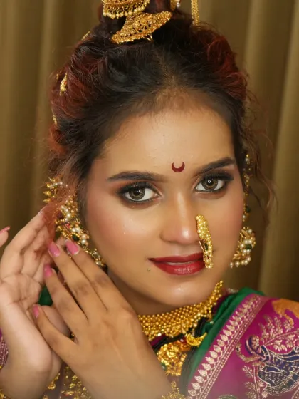 A detailed shot of the eye makeup and jewelry. Learning to work with different skin tones and face shapes is a core part of my advanced bridal makeup course.