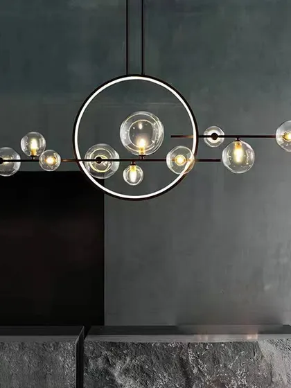 This horizontal chandelier features an LED ring intersected by a bar of glass globes, creating a unique and balanced composition for modern interiors.