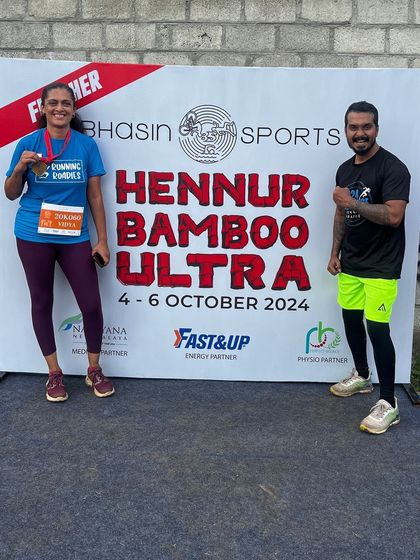 Two runners celebrating their finish at the Hennur Bamboo Ultra. Completing a race is a huge achievement, and we love capturing these moments of triumph.