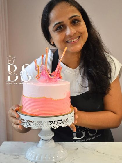 This student created a beautiful two-tone pink cake with a textured finish and a vibrant isomalt splash topper.