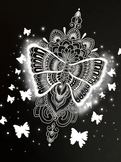 This illustration features a butterfly with its wings made of intricate mandala and zentangle patterns. The white ink on black paper creates a glowing, ethereal effect.