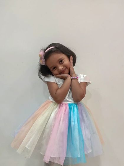 A rainbow of pastel tulle makes this dress pure magic. It’s a fun, vibrant, and dreamy choice for a birthday girl who loves color and wants to stand out.