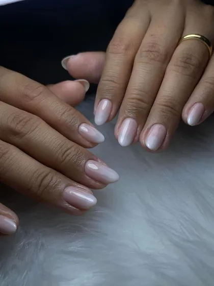 A soft and natural-looking ombre on short, rounded nails. This shows that beautiful nail enhancements can be done on any nail length.