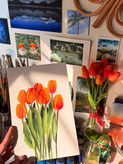 Here is the finished tulip painting held up in my studio. You can see how it fits in with the other pieces on my art wall, creating a corner of color and nature.
