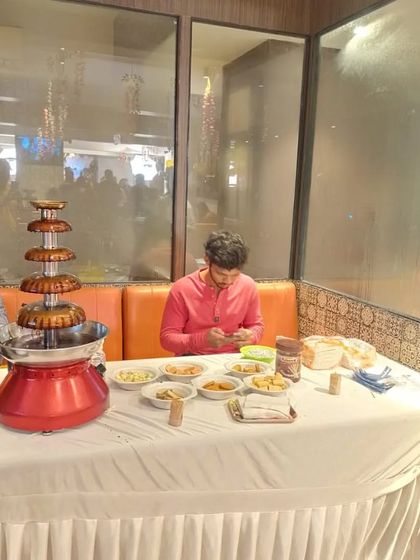 A chocolate fountain station we arranged for a birthday party. It comes with a variety of dips like fruits, marshmallows, and wafers, and is a delicious treat for all guests.