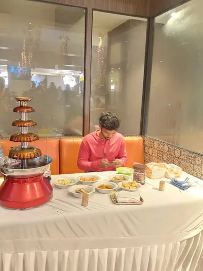 A chocolate fountain station we arranged for a birthday party. It comes with a variety of dips like fruits, marshmallows, and wafers, and is a delicious treat for all guests.