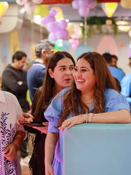Parents watching the festivities with smiles. We handle everything so you can focus on enjoying the moment with your child.