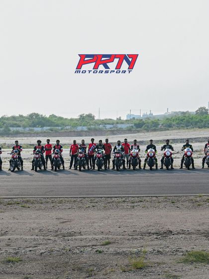 A group photo of our riders and coaches on the track, capturing the sense of community.