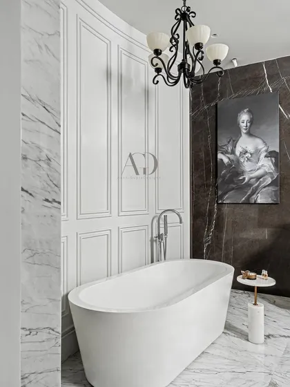 A final view of this designer bathroom, highlighting the addition of a classical portrait. This artistic touch elevates the space, reinforcing the idea that every room in the home should be a reflection of personal taste and history.