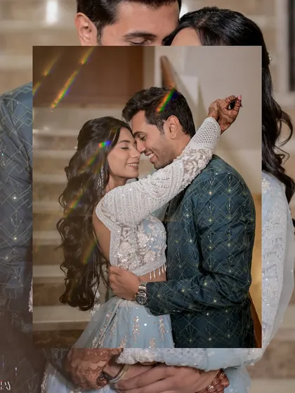 A creative portrait with a prism effect, casting a subtle rainbow flare over the couple's embrace. This technique adds a touch of magic and visual interest to a classic romantic pose.