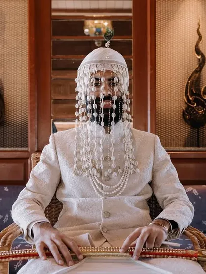 The groom's story is one of pride, anticipation, and tradition. I take the time to create powerful portraits that reflect his personality, whether it's a quiet moment of reflection or a regal pose with traditional elements like the sehra and sword.