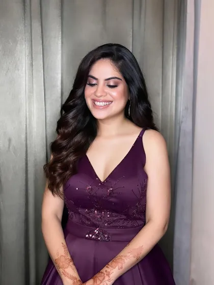 A lovely open hairstyle with natural waves, perfect for a party or a bridesmaid.