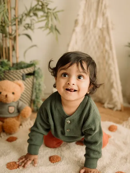 A curious, upward glance that perfectly captures the wonder of toddlerhood.