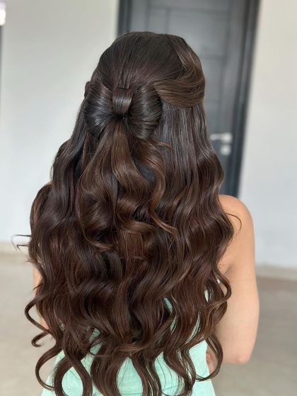 A back view of the hair bow style, showing how the bow is crafted from the hair itself for a seamless look.