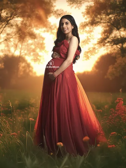 A golden hour dream. This outdoor-style portrait, created in my studio, uses warm, sunset lighting and a field of flowers to craft a romantic and glowing image of the mother-to-be.