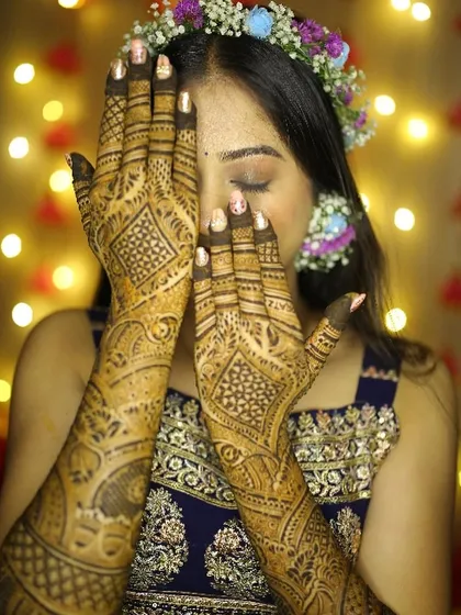 A close-up on the beautiful Mehendi design. The soft, shimmery eye makeup I created adds a touch of glamour without taking away from the traditional art.