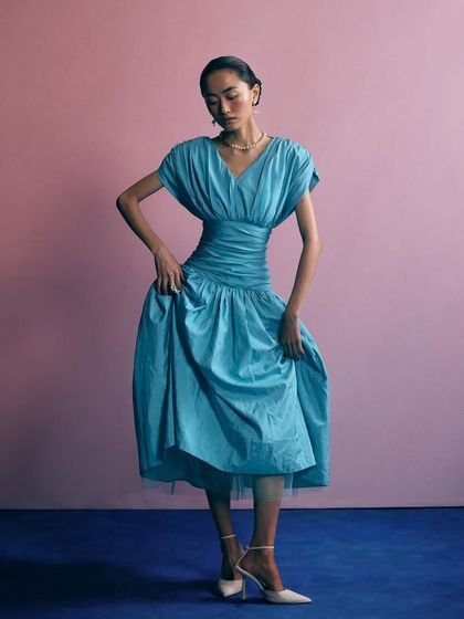 A vintage-inspired look for Voyce Jewellery. The blue dress and pearl accessories create a timeless, graceful image.