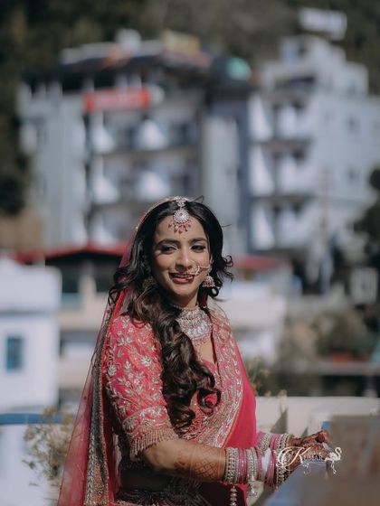 A candid shot of a bride enjoying a moment on a balcony during her destination wedding.