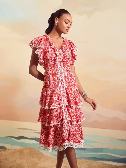 A three-quarter view of the Valentina Long Dress by Qala Clothing, highlighting the tiered ruffles and delicate lace trim.