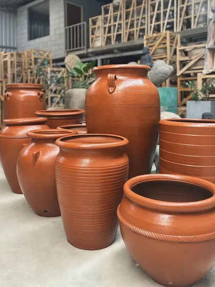 Welcome to my terracotta range, where earthy elegance meets artistry. This collection shows the variety of shapes and sizes I offer, from classic pots to handled urns, all in a warm, natural finish.