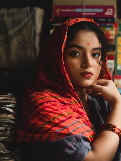 A character-driven look for an editorial shoot. I created a simple, clean makeup look with a red bindi and a classic red lip, suitable for a narrative-focused photoshoot.