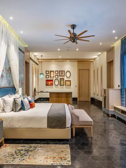 A whimsical suite at Taj Devi Ratn, Jaipur, where I used a custom hot-air balloon themed wallpaper to evoke a sense of fantasy and flight. The design combines playful motifs with luxurious textiles and a canopy bed to create a truly unique and soulful room.