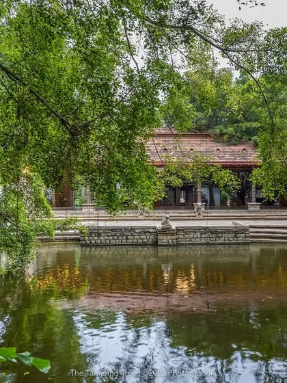 The serene Pond Pavilion reflected in the calm waters of the Kalyani at dusk. This view captures the tranquil, nature-inspired setting that makes our venue a peaceful escape from the city.
