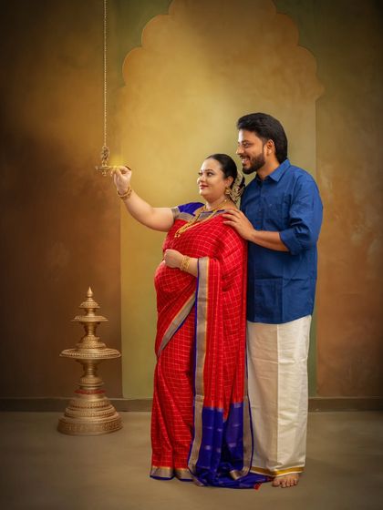 Lighting the lamp together symbolizes the start of a new life. This shot captures a traditional ritual, filled with hope and blessings for the journey into parenthood.