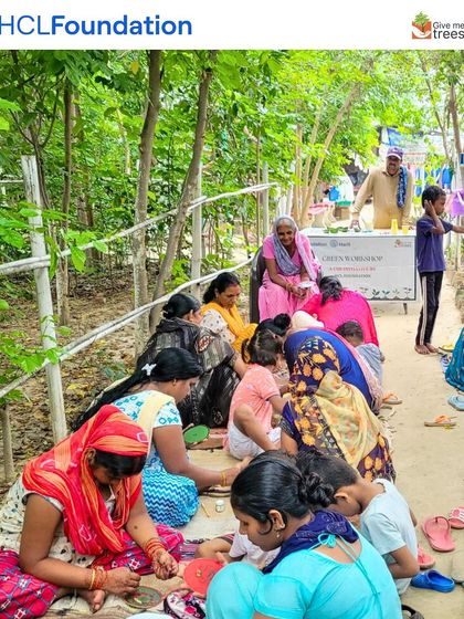 A candid shot of the community art workshop in progress. It's a beautiful scene of shared creativity and learning among women of all ages.