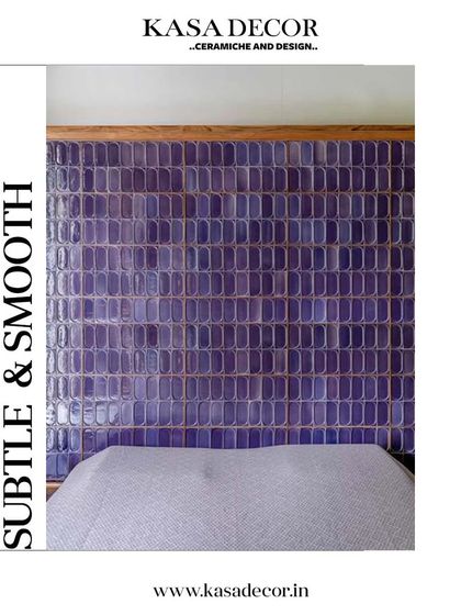 A subtle and smooth application of our handmade tiles as a headboard. The deep purple glaze and unique texture add a touch of bespoke luxury to the bedroom.