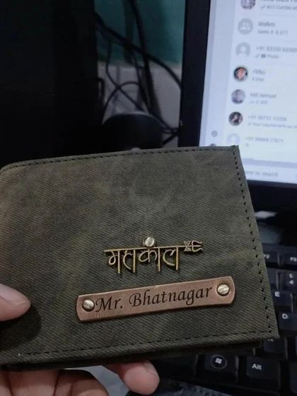A personalized wallet with 'Mahakal' in Hindi script, a perfect gift for a devotee.