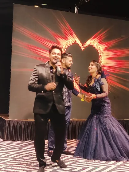 A candid moment of joy on the reception stage with the happy couple. My goal is to create a comfortable and fun atmosphere where everyone can be themselves.
