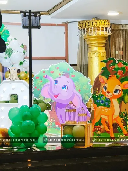 A closer view of the right side of the jungle stage, featuring Dumbo and Bambi cutouts. The small details, like the crate of green balloons, add texture and depth.