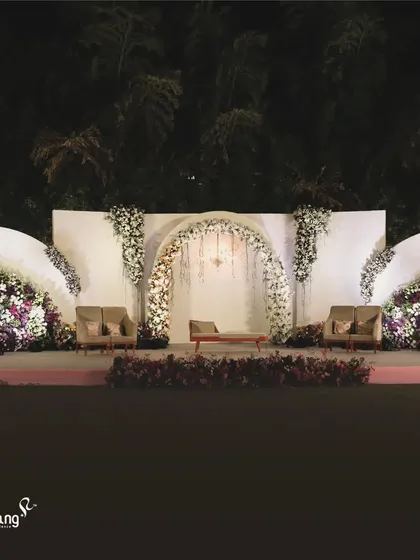 A wide view of the wave-inspired floral stage. The design creates a dynamic and organic feel, showcasing my ability to create unique, conceptual backdrops.