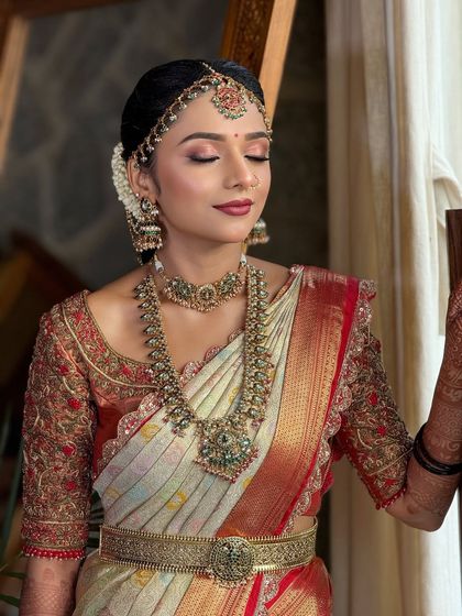 A serene portrait of the bride. The soft-focus eyeshadow and perfectly blended base give her a dreamy, ethereal glow for her special day.