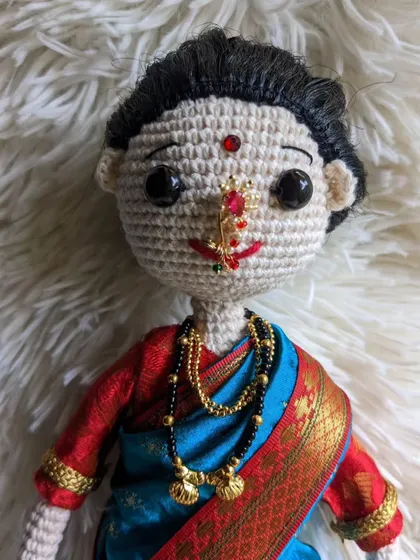 A close-up showing the delicate nath and mangalsutra.