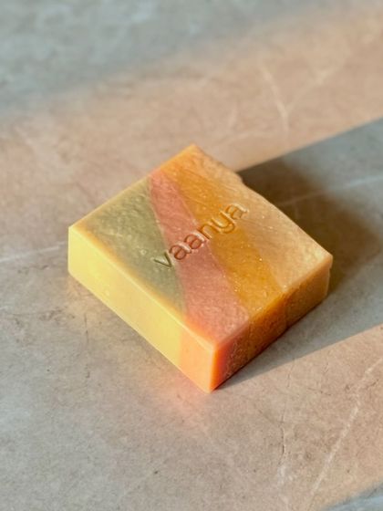 A single bar of our Tropical Escape soap, part of our Summer 2025 collection. The diagonal layers of color are just so cheerful and fun.