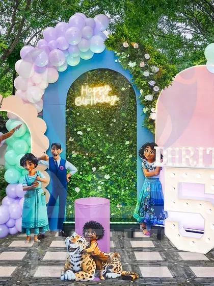 I can bring any theme to life, even in an outdoor setting. This is a design concept for a party based on the movie Encanto, showcasing how I use vibrant colors and character cutouts to create a festive atmosphere.