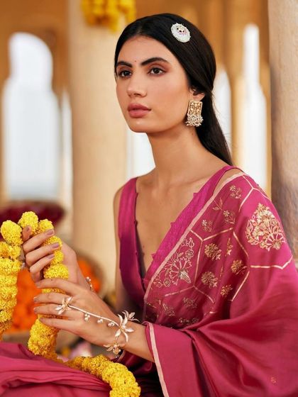 A closer view of the half-up style from the AJIO campaign. The side accessory adds a subtle decorative touch to the otherwise simple and elegant hairstyle.