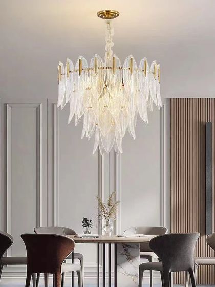 A stunning chandelier with cascading, feather-like glass pieces. This fixture is perfect for a formal dining room, adding texture and elegance.