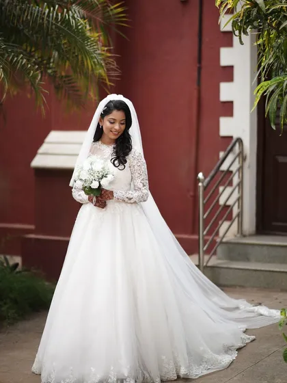 Creating this elegant look for a beautiful church wedding was a joy. I aimed for a timeless and romantic style with soft makeup and classic waves, ensuring the bride felt radiant and comfortable in her stunning white gown.
